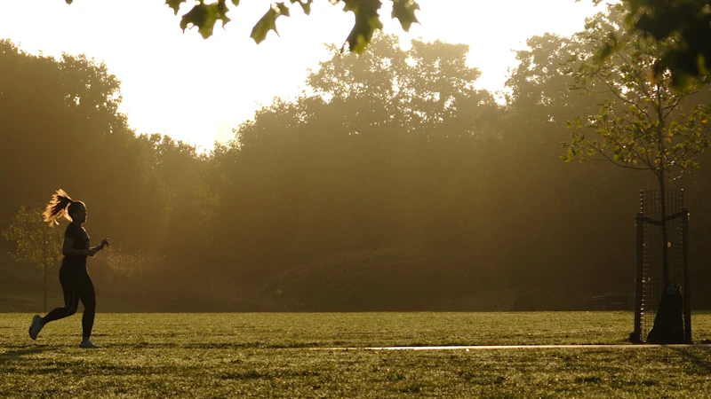 Person running in a park at sunset — flex hours for life's priorities