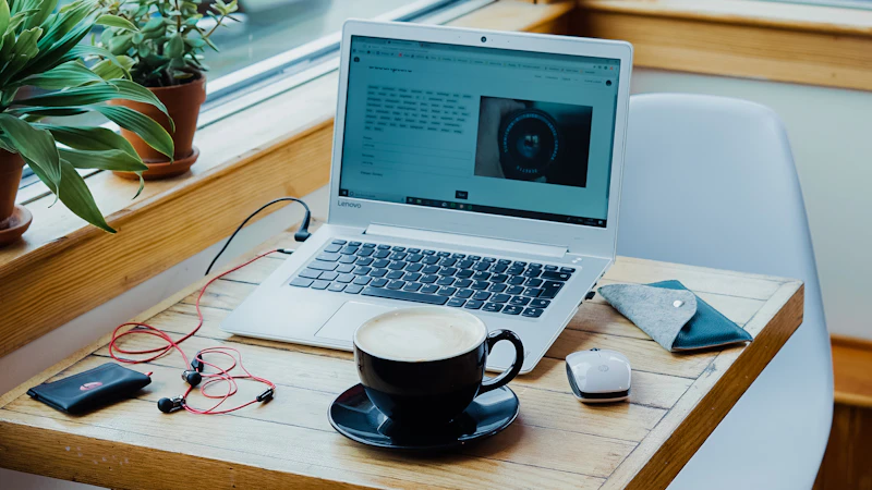 Laptop and coffee in a cafe — the remote work lifestyle